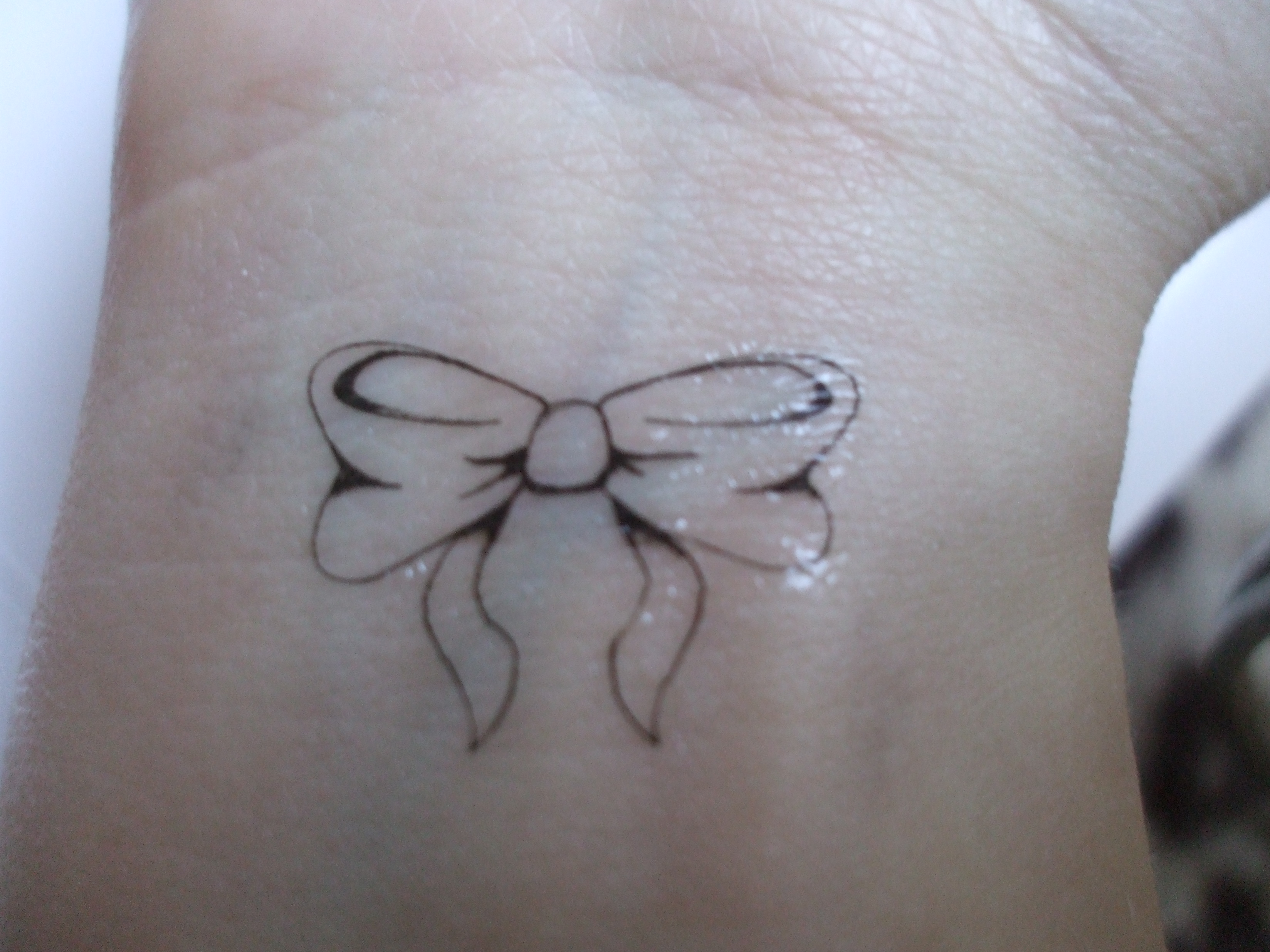 Bow Tattoos Designs, Ideas and Meaning