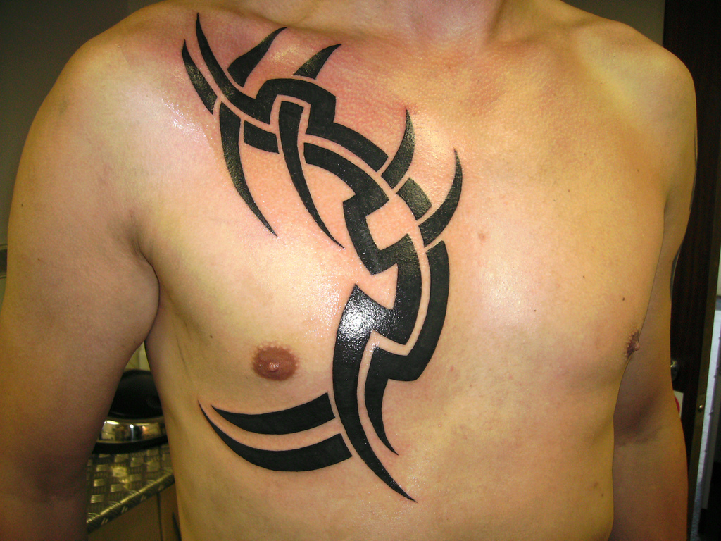 Tribal Sun Chest Tattoo