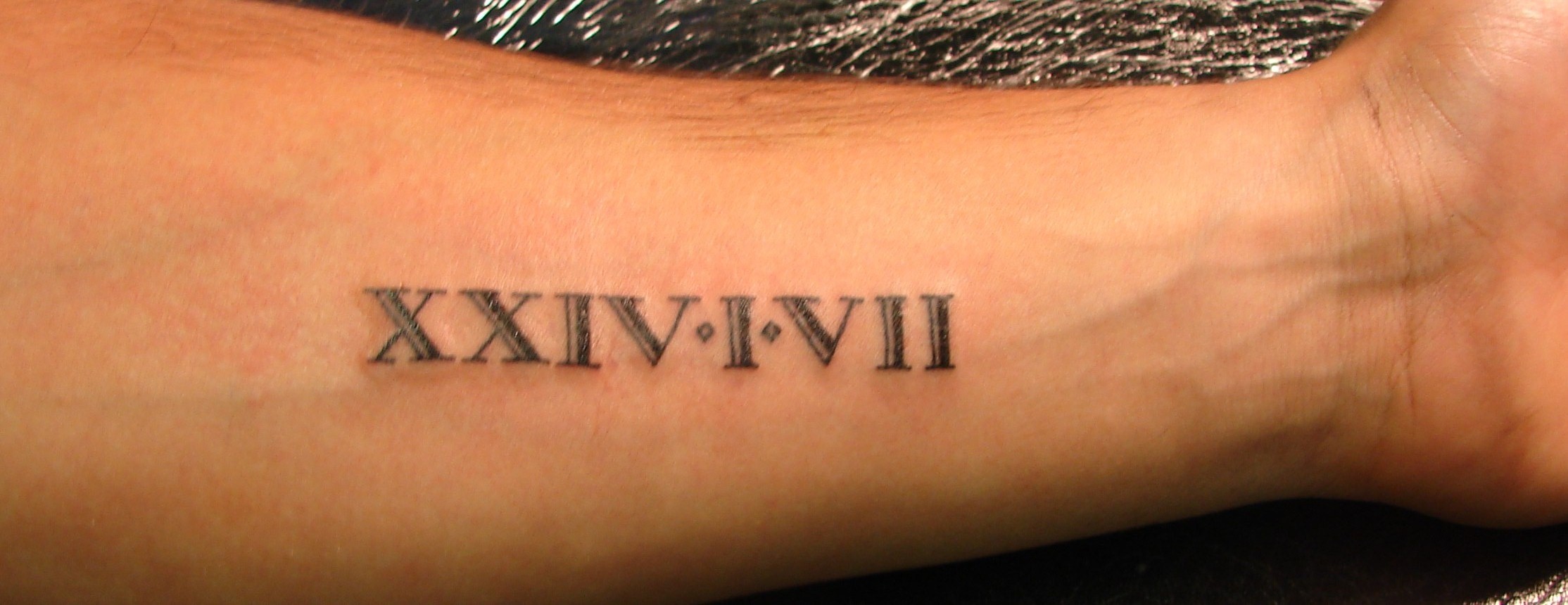 3. Small Roman Numeral Bicep Tattoos - wide 3