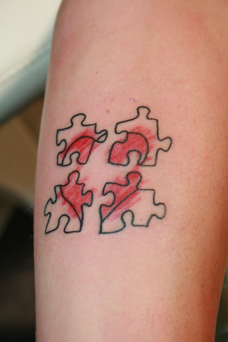 What are puzzle piece tattoos?