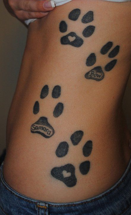 paw print rib tattoos