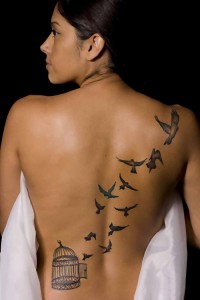 Bird Flying Out of Cage Tattoo