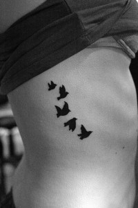 Flying Bird Tattoo on Ribs