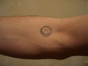 Smiley Face Tattoo on Hand