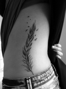 Feather Bird Tattoo on Ribs