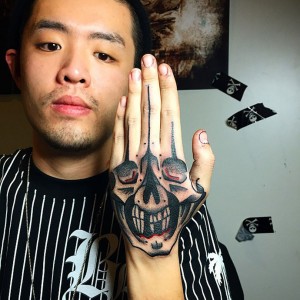 Hand Skull Tattoo Designs