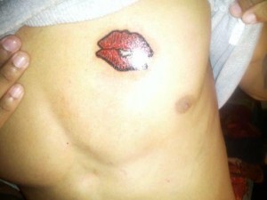 Kiss Tattoos on Chest