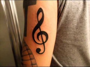 Treble Clef Tattoo Arm