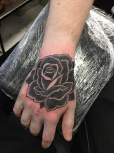 Black Rose Hand Tattoo