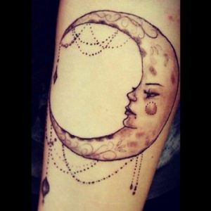 Crescent Moon Face Tattoo