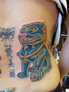 Female foo Dog Tattoo
