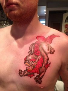 Foo Dog Chest Tattoo