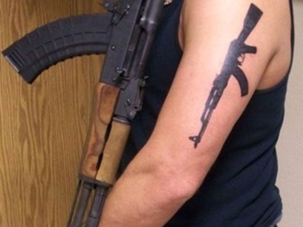 Gun Tattoos on Arm.