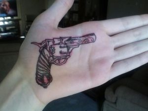 Revolver Tattoo on Hand