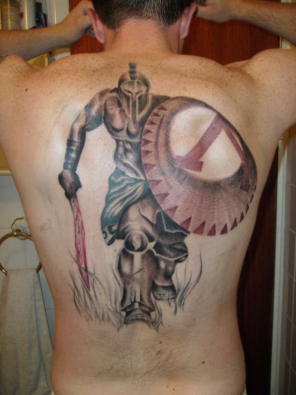 Spartan tattoo on the left upper arm, inspired by 300.