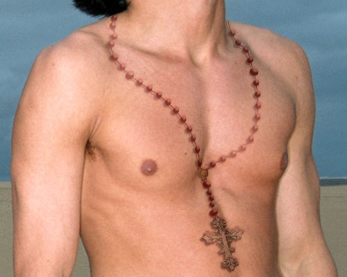 2. Small rosary tattoo on chest - wide 7