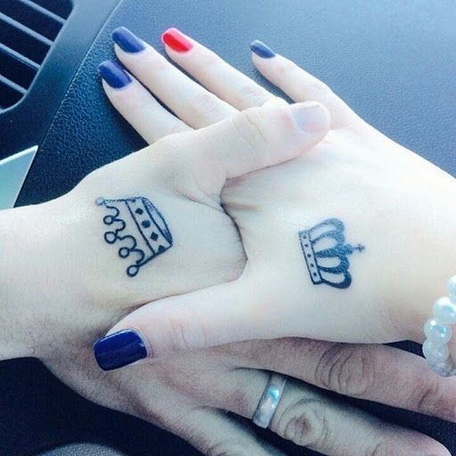 Cute matching king and queen tattoos done by A.one @tattoos_by_a.one . Come  in with your partner or friends to get matching tattoos at…