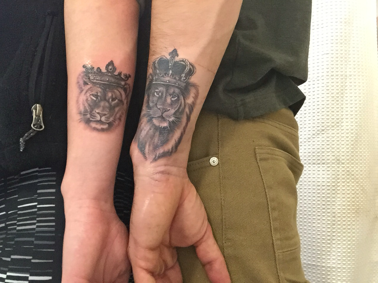 Pictures of Matching Lion Tattoos.