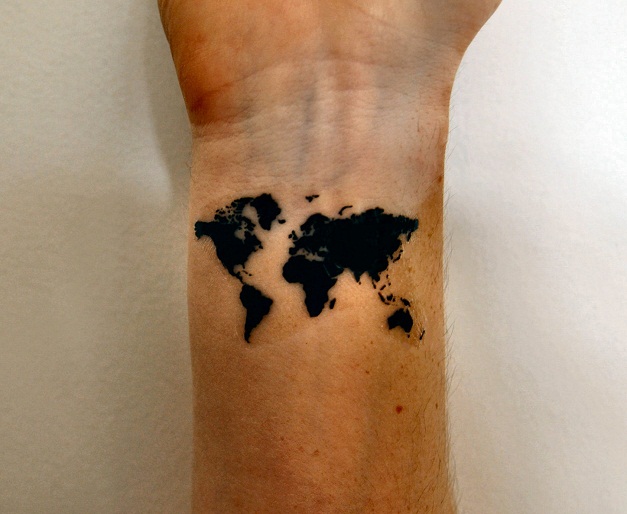 world tattoo on wrist